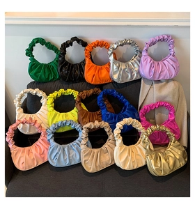 Detailed grid of ruched crescent cloud bags in fourteen vibrant synthetic leather colors