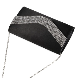 Macro view of black satin evening clutch featuring a shimmering crystal V-shaped embellishment