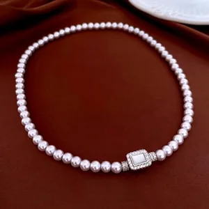 Vintage pearl necklace with a zircon-set rectangular pendant on premium velvet fabric