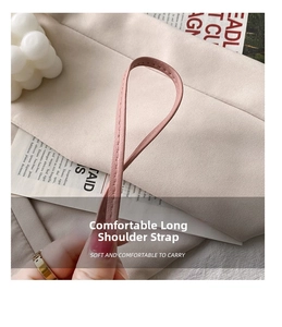 Detailed view of flexible pink faux leather shoulder strap with fine stitching