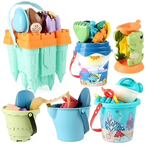 Children beach toy set with bucket, water wheel, sand shovel, and molds on white background