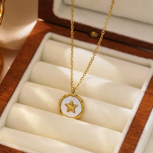 18k gold plated stainless steel necklace with white shell star pendant on wooden box