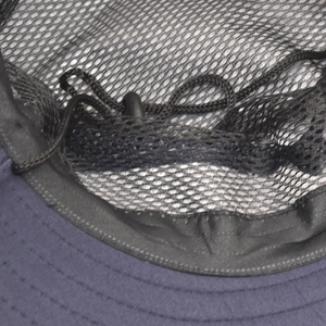 Detailed close-up of breathable mesh lining and adjustable chin strap on the sun hat