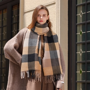 Plaid oversized tassel scarf in mustard yellow and grey earthy tones for winter warmth
