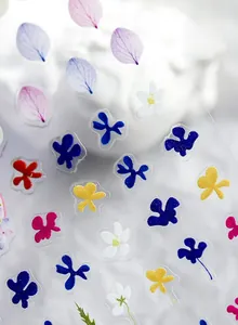 Detailed macro view of high-quality Japanese floral nail stickers with matte dry flower patterns