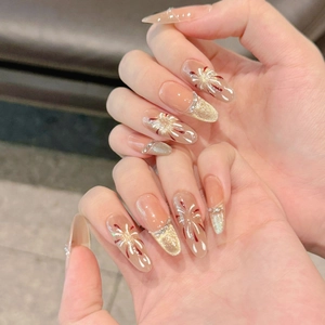 Pink cat eye press-on nails with hand-painted firework design and sparkling glitter detail