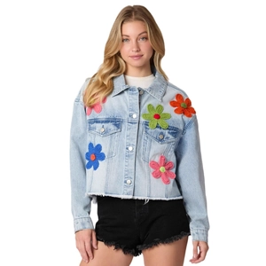 Blue denim jacket with colorful 3D knit floral decorations and metal buttons on white background
