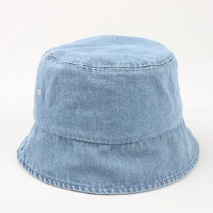 Close-up of light blue washed denim bucket hat with detailed white stitching accents