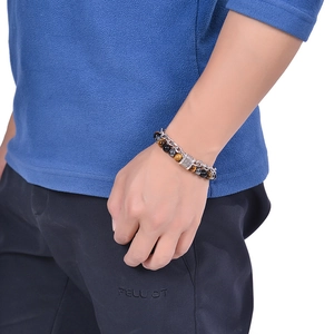 Close-up of men's double-layer bracelet with tiger eye beads and silver chain link