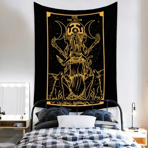 Bohemian The Moon tarot tapestry hanging over bed in a modern minimalist bedroom