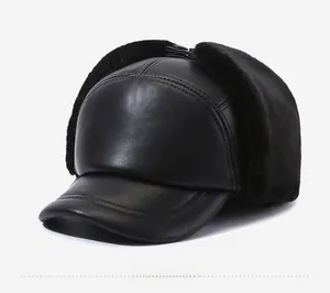 Detail view of winter earflap hat with black faux leather and thick thermal fur lining
