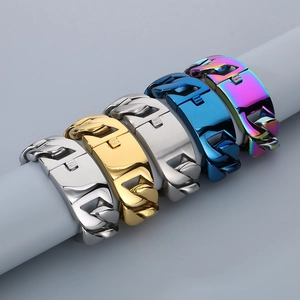 Detail of 31mm wide Cuban link bracelets in gold, silver, blue, and rainbow finishes