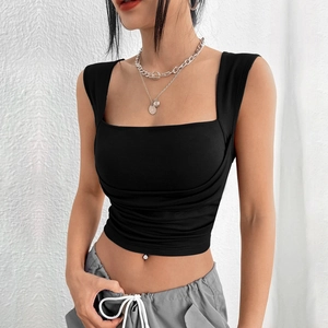 Close-up of black square neck cropped vest with ruched details and slim fit knit fabric