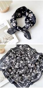 Detail of soft cotton linen square scarf with elegant white cherry blossom prints on black