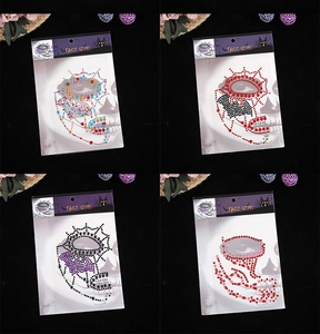 Macro detail of various Halloween face gems including spider and bat crystal stickers