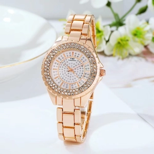 Detailed view of a rose gold women's watch with sparkling rhinestone accents.