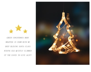 Close-up of a warm yellow LED Christmas tree window light with a blurred night background