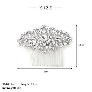 Detail of silver bridal hair comb with intricate floral rhinestones and metal teeth