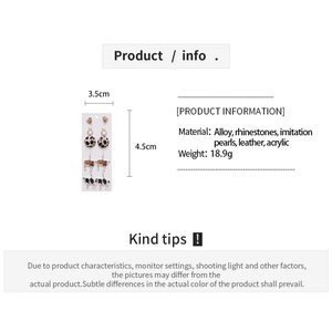 Detailed view of mixed materials earrings set featuring leopard print and cow patterns