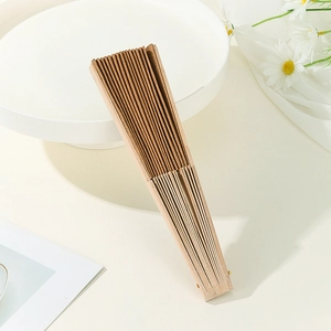 Detailed macro view of a folded Portuguese cork hand fan with vintage wooden texture decor