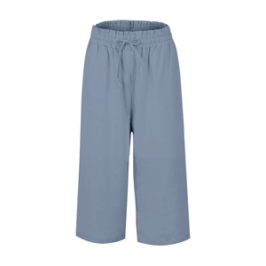 Detail of high-waisted linen pants featuring elastic waistband and adjustable drawstring knot
