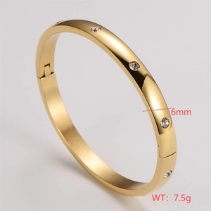 Detailed macro view showing the 6mm width and 7.5g weight of this gold-plated bangle