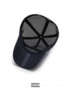 Close-up of the interior mesh structure of a navy blue breathable baseball cap