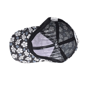 Detail view of cotton baseball cap interior featuring 100% polyester floral lining and straps