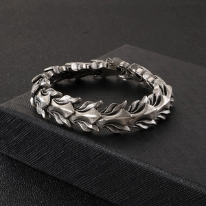 Vintage punk dragon bone chain bracelet in antique silver finish for men on jewelry box