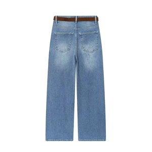 Flat lay of high waisted wide leg denim culottes with a brown frosted belt in blue wash