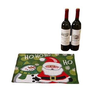 Christmas placemats with cartoon Santa Claus and snowman patterns on a green background