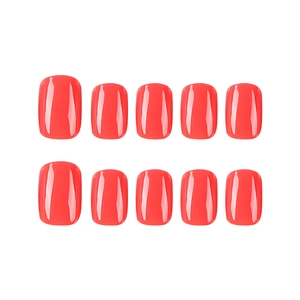 Glossy bright orange-red short square press-on nails set on a clean white background