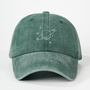 Close-up of a vintage forest green cotton baseball cap with white planet embroidery