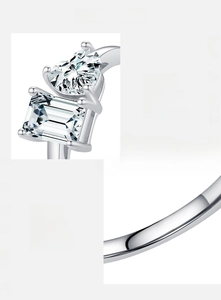 Detail of S925 sterling silver ring with emerald and heart cut hand-set cubic zirconia