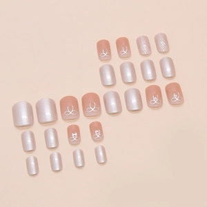 French champagne and pink gradient press-on nails with 3D bow and mirror finish