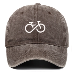 Close-up of bicycle embroidery on a washed brown vintage cotton baseball dad hat