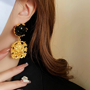 Vintage gold lion head earrings with black resin detail in luxury baroque style