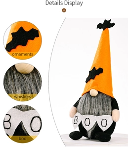 Detail display of Halloween gnome with orange hat, bat ornaments and boo banner