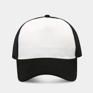 Detailed front view of a black and white trucker hat with mesh back and suede brim