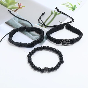 Three-piece set of black braided leather bracelets with tree of life and cross shield charms