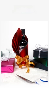 Detail view of colorful metallic gift wrapping paper with silk ribbons and luxury texture