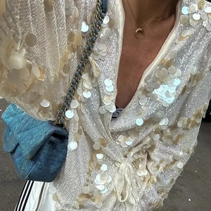 Chic women's V-neck blouse featuring sparkling sequin patchwork in cream and gold