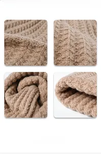 Detail view of thick cable knit texture and ribbed patterns on a winter beanie hat