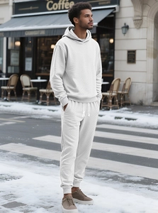 Detail of white knitted tracksuit with a unique 3D diamond texture in an outdoor setting