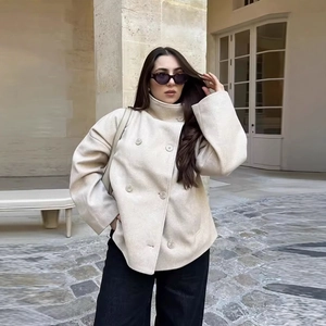 Women's chic beige double-breasted short wool coat in a loose fit for autumn fashion