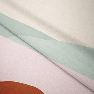 Macro view of soft brushed fabric texture and bohemian color block stitching details