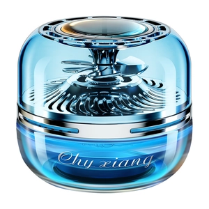Solar powered rotating blue car aromatherapy diffuser with liquid fragrance on white background