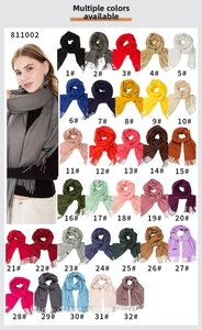 Catalog view of solid color tassel scarves in 32 vibrant cashmere-like fabric shades