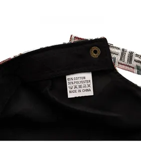 Detail of the inner lining and washing label of the plaid jacquard newsboy cap