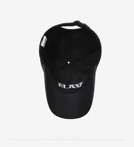 Internal view of black cotton baseball cap showing wash label and inner embroidery detail